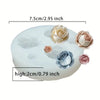 White silicone mold shaped like a rose for chocolates, candy, and fondant.