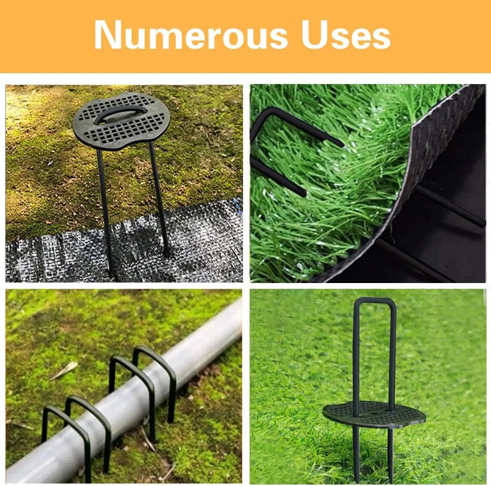 A set of black galvanized U-shaped garden staples used for securing landscape fabric and netting on grass.