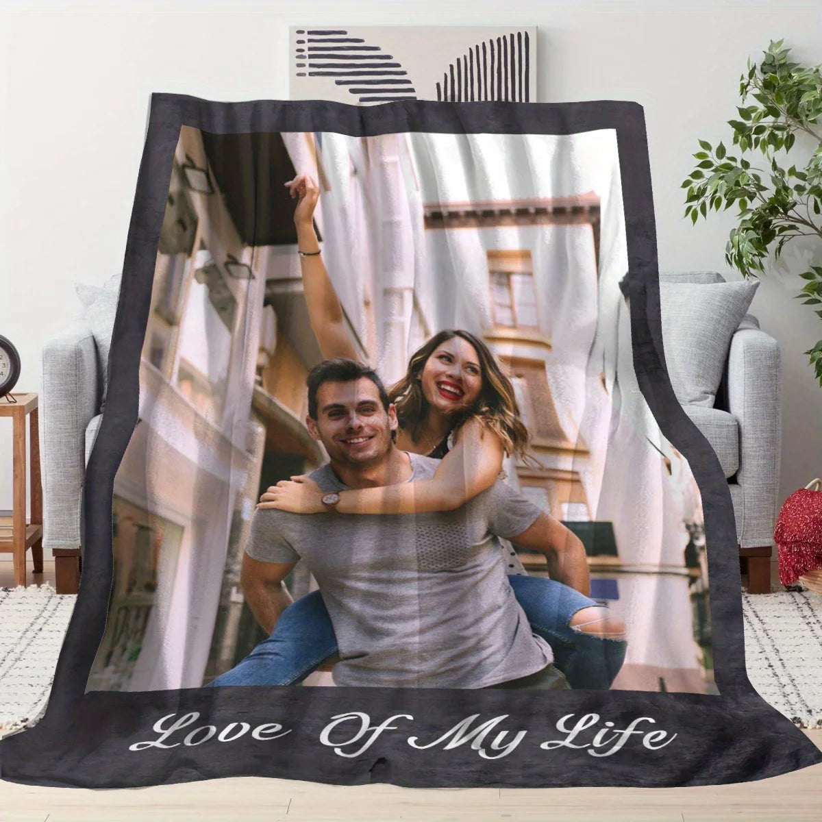 A photo blanket featuring a couple smiling, with the text Love Of My Life printed on the front.