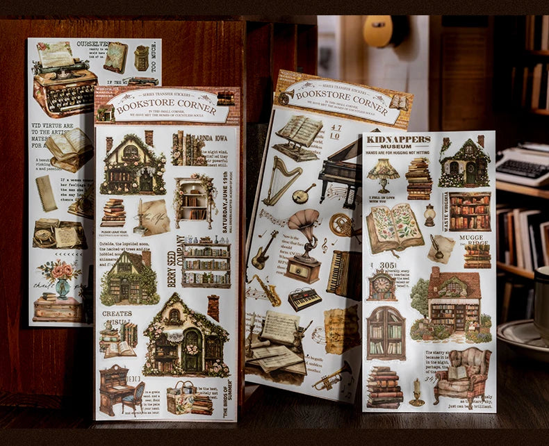 Sammlung von Vintage-Transferstickern mit antiken Büchern, Werkzeugen und Dekorationen für Scrapbooks