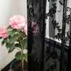 Two panels of vintage floral lace sheer curtains in black and white patterns.