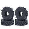 A pair of black rubber mud terrain tires for Axial SCX24 and TRX4M