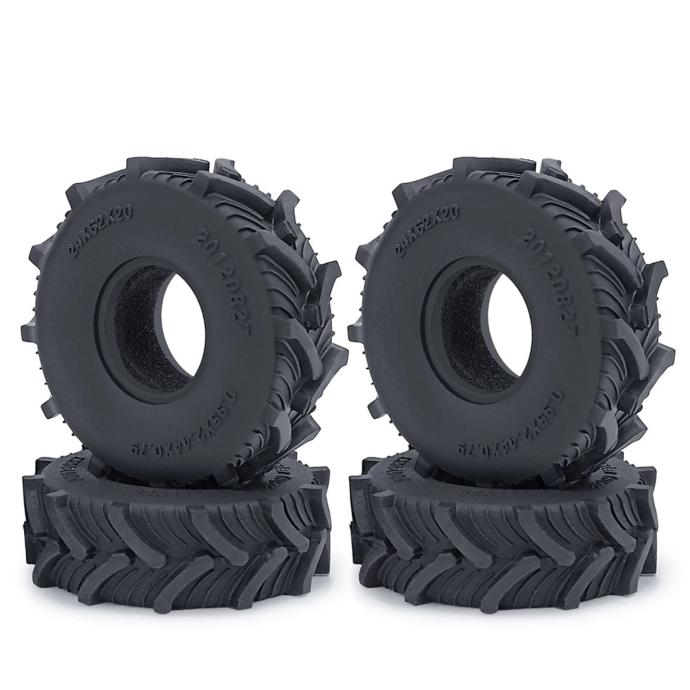 A pair of black rubber mud terrain tires for Axial SCX24 and TRX4M