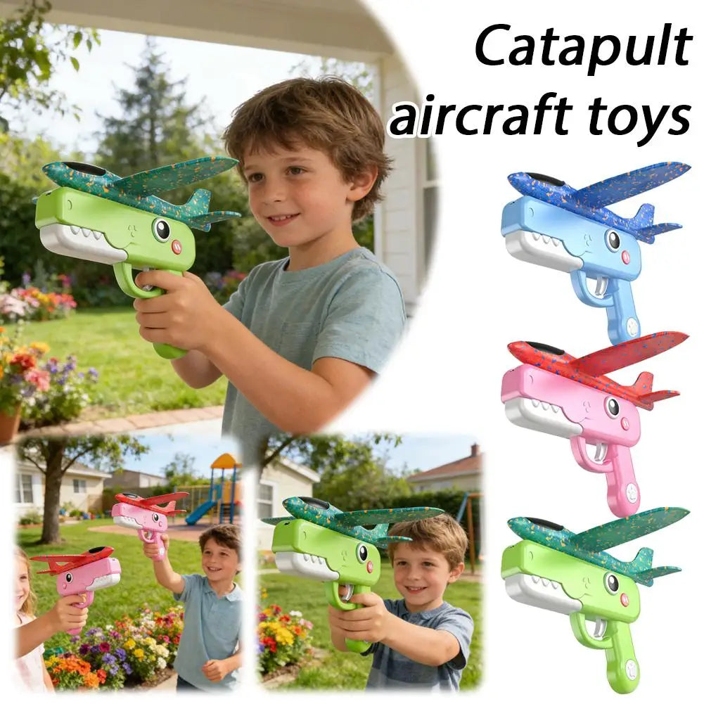 A boy is holding a green foam catapult airplane toy outdoors, demonstrating its use.