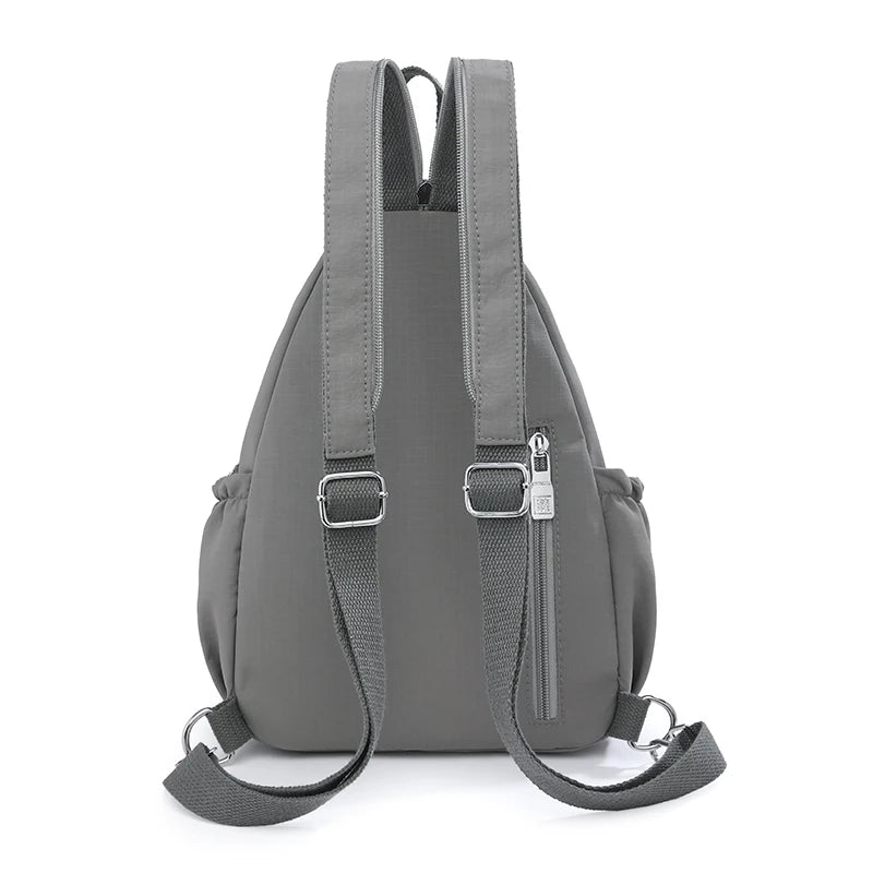A gray waterproof nylon crossbody sling bag shown from the back.