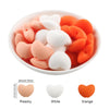 A bowl filled with ten silicone heart beads in peach, white, and orange colors.