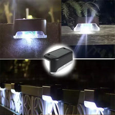 Close-up view of solar-powered LED step lights illuminating outdoor stairs and paths.