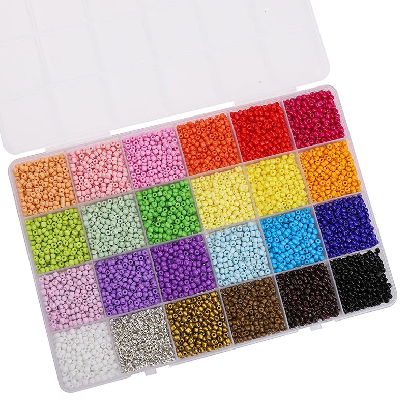 A clear plastic box filled with various colors of glass rice beads for jewelry making