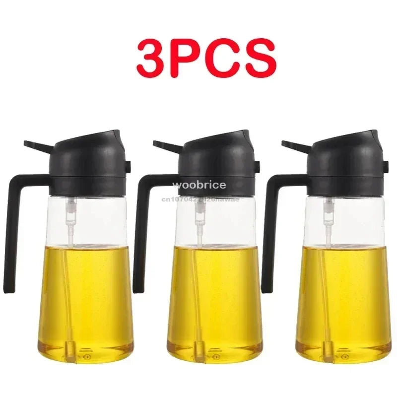 Three glass oil spray bottles with black pumps and yellow oil inside