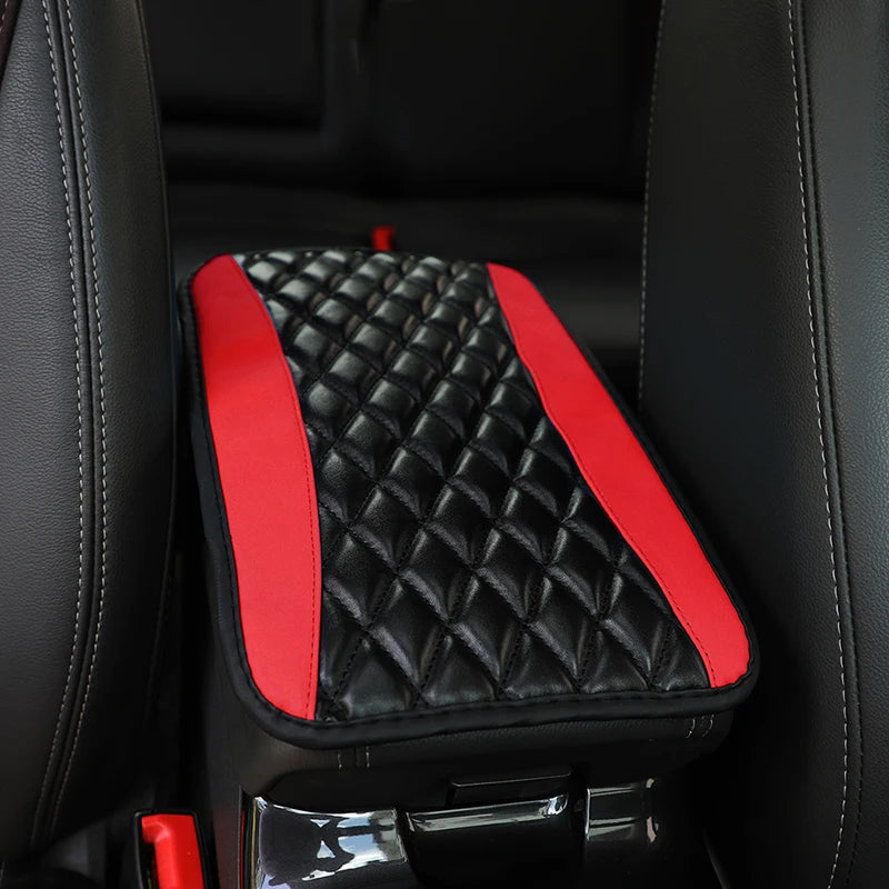 Black and red quilted PU car armrest cover with storage pad shown in a vehicle interior.