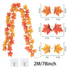 Artificial maple leaf garland in autumn colors featuring orange and yellow leaves