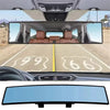 Wide angle convex car interior rear view mirror showing the dashboard and front seats.
