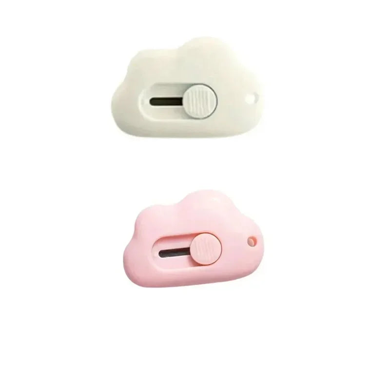 A small, white plastic compact rabbit mini cutter with a retractable blade.