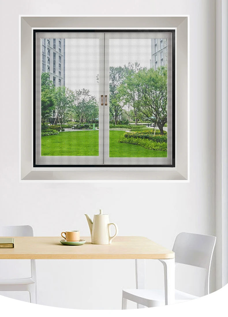 A close-up view of a reusable self-adhesive mosquito window screen installed in a white window frame.