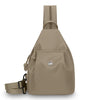 A beige women's lightweight mini backpack with a chest strap visible from the front.