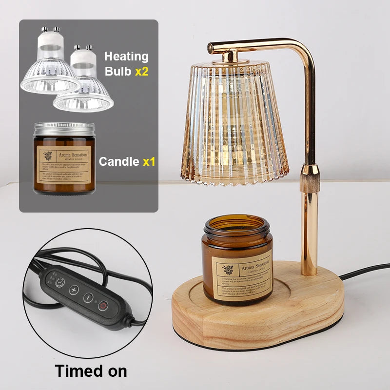 A brass candle warmer lamp with a glass shade and wooden base, shown next to a jar of wax and a timer device.