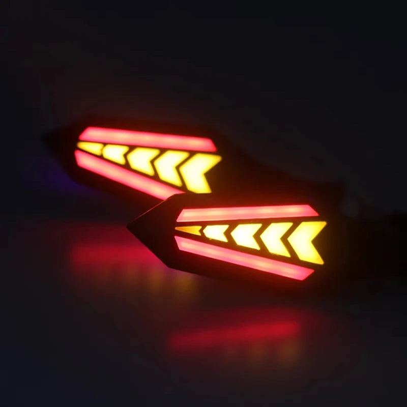 A close-up of a motorcycle turn signal indicator with bright yellow and red LED light bars.
