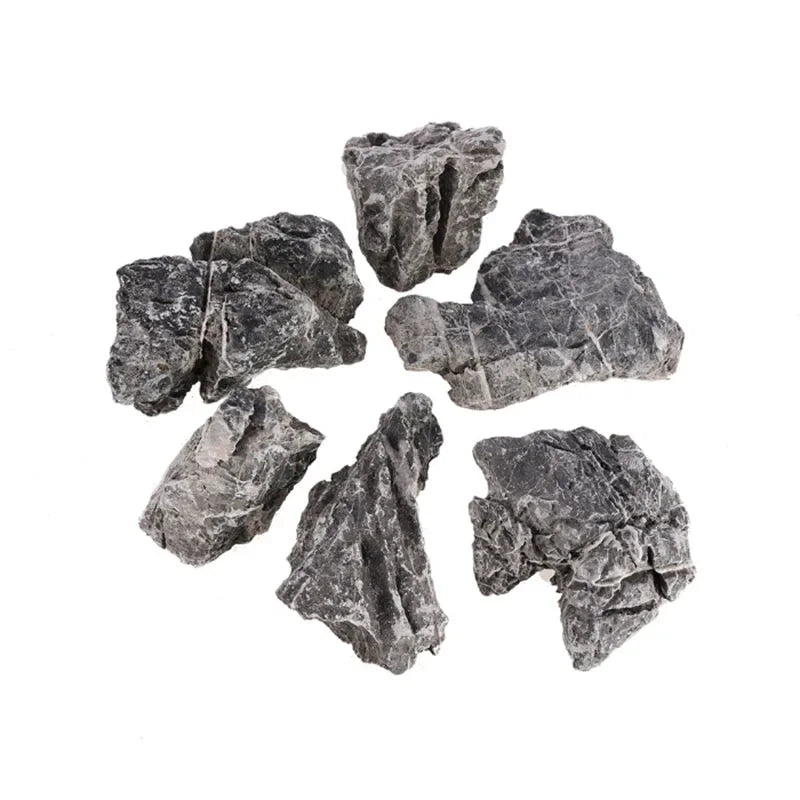 A collection of irregularly shaped natural grey aquarium stones for aquascaping and fish tank decoration.