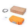 An orange portable 4-digit combination safe lock box is shown next to its cardboard packaging and a black steel cable.