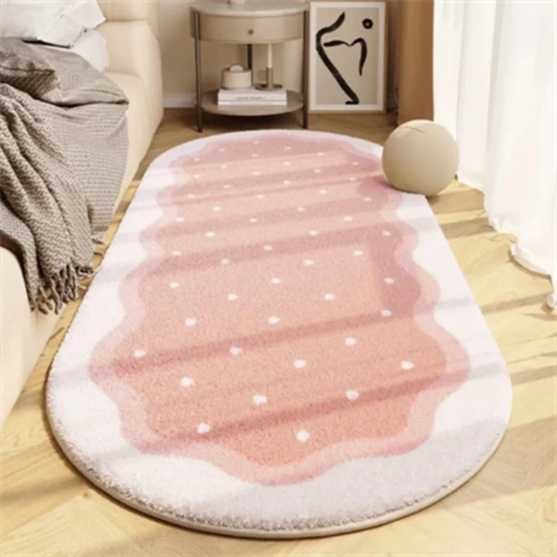 A pink and white decorative area rug with subtle stripes and floral accents on a light wooden floor.