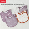 A set of seamless purple and white cotton baby bibs with floral patterns shown on a white background.