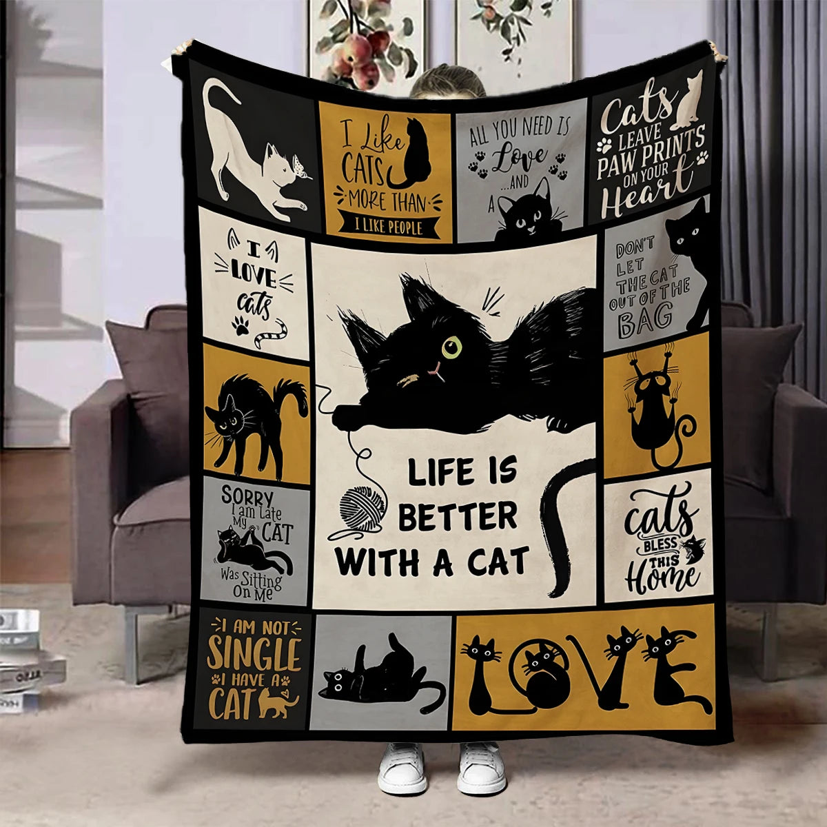 A black and gold patterned flannel throw blanket featuring cat-themed sayings for bed or sofa.