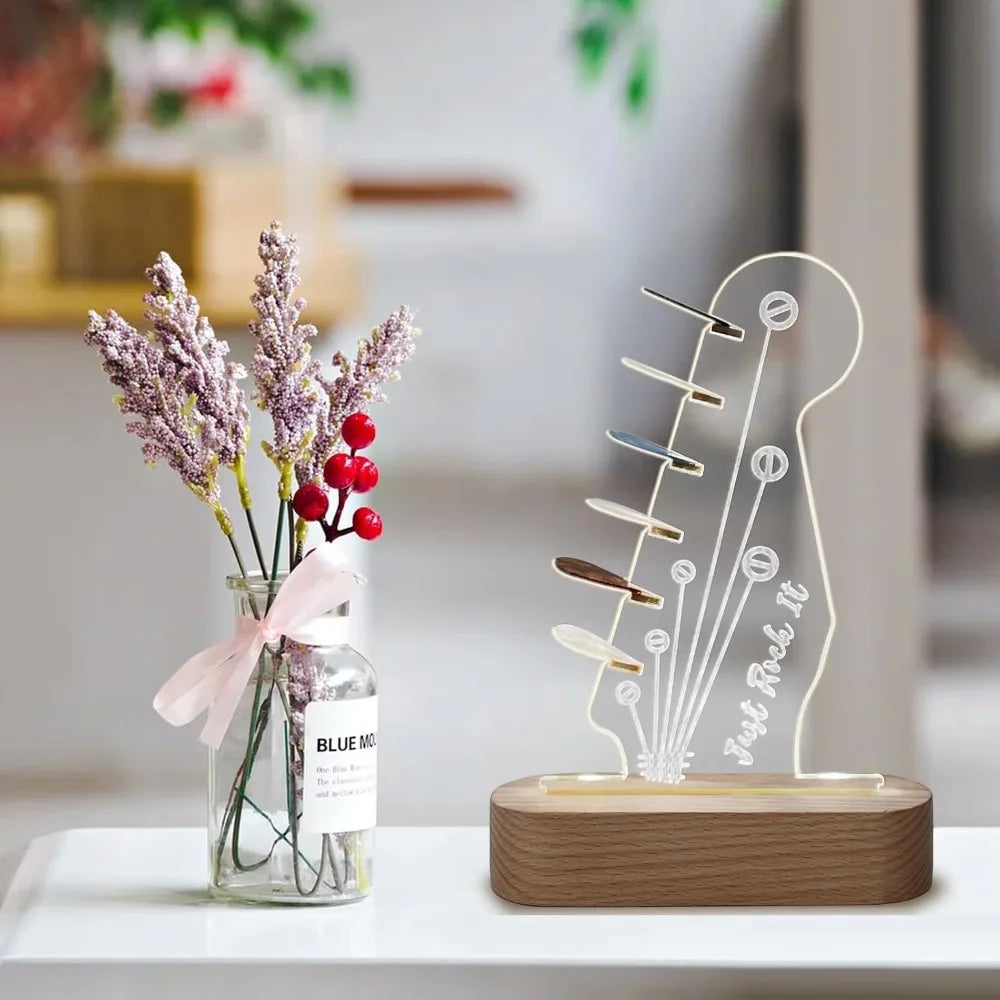 Illuminated acrylic guitar pick holder with a wooden base and dried lavender flowers