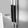A close-up of two black velvet anti-skid protector covers for refrigerator handles.