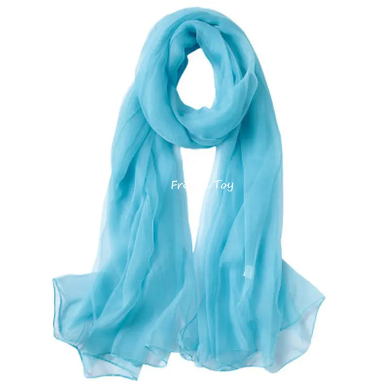 Light blue sheer silk scarf draped elegantly