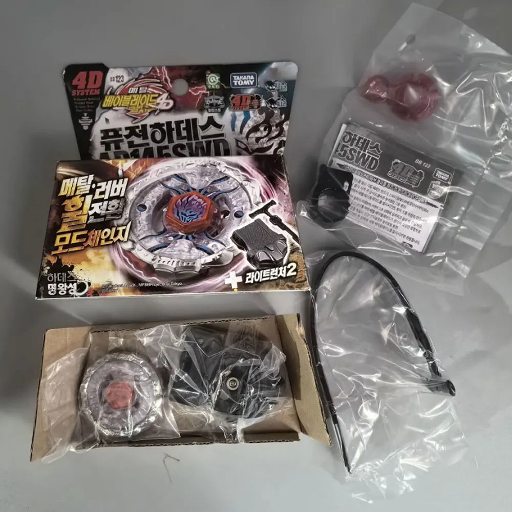 A set of 4D spinning tops and related accessories packaged in cardboard and plastic bags.