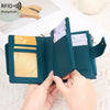 A close-up of a dark teal RFID-blocking bi-fold wallet being held open to show the interior and card slots.