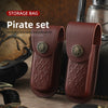 A pirate set of brown leather folding knife cases with brass accents displayed on a dark surface.