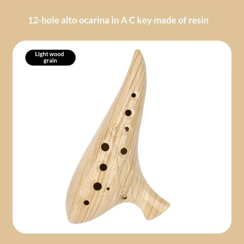 A light wood grain 12-hole alto ocarina in A key made of resin.