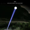 A bright beam of light from a flashlight illuminates the ground, demonstrating ultra-long focus.