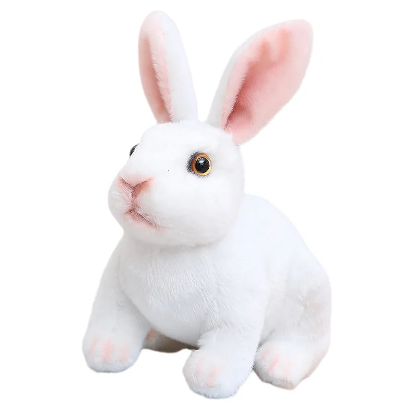 A white plush rabbit stuffed animal with pink inner ears and dark eyes.