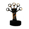 A black adjustable finger strengthener tool with a wrist strap and weight markings.