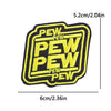 Yellow embroidered iron-on patch with the word PEW repeated in a bold font on a black background