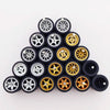 A set of ten 1:64 scale alloy car wheels and tires, featuring silver and gold colored rims.