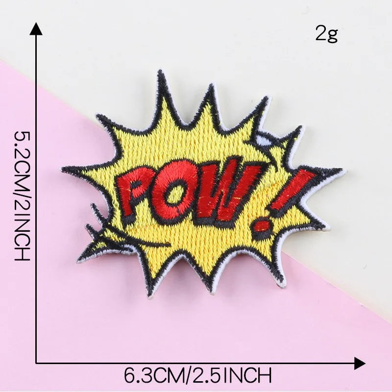 Yellow embroidered lettering patch with the word POW in red and white, featuring a starburst shape.