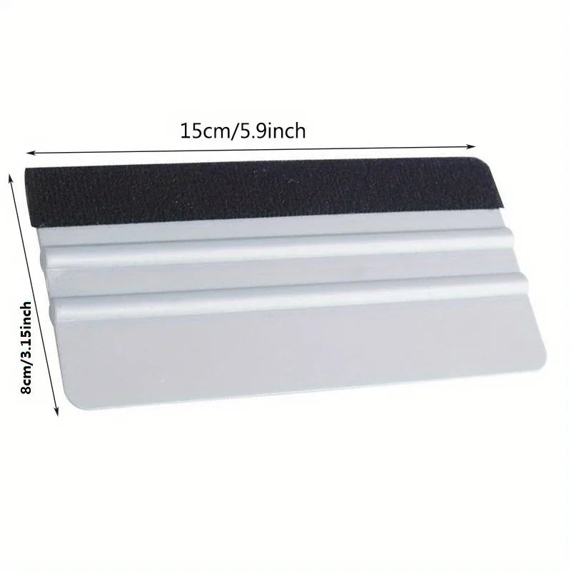 A black and white scratch-free vinyl applicator tool with a 15cm length.