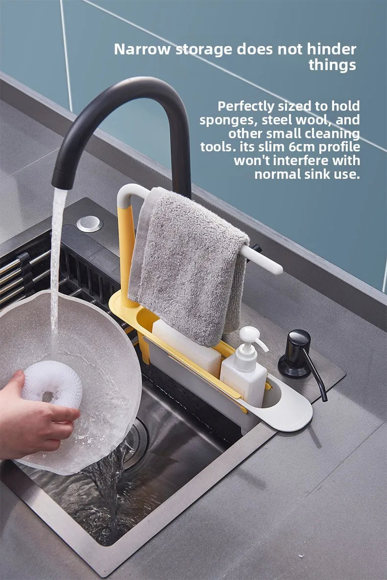 A close-up of an adjustable sink sponge holder with a drainer basket and a flexible faucet in a kitchen sink.