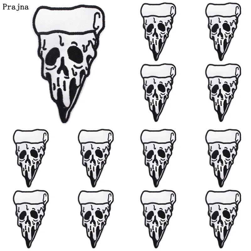 A set of ten black and white embroidered iron-on patches featuring skull designs.