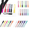A collection of colorful plastic zipper pulls in various shapes and colors, including pink, yellow, green, and black.