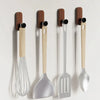 A set of self-adhesive walnut wood hooks with silicone tops for entryway and bathroom organization.