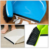 A blue compact handheld dustpan and brush set with a black cleaning pad and white plastic components.
