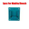 A teal wall-mount battery holder for Makita or Bosch power tools.