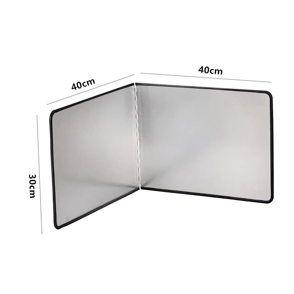 A foldable stainless steel splatter guard for the stovetop, shown in a closed, rectangular form.