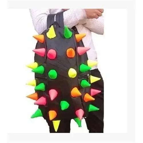 A black backpack decorated with yellow and green spikes, worn by a person.