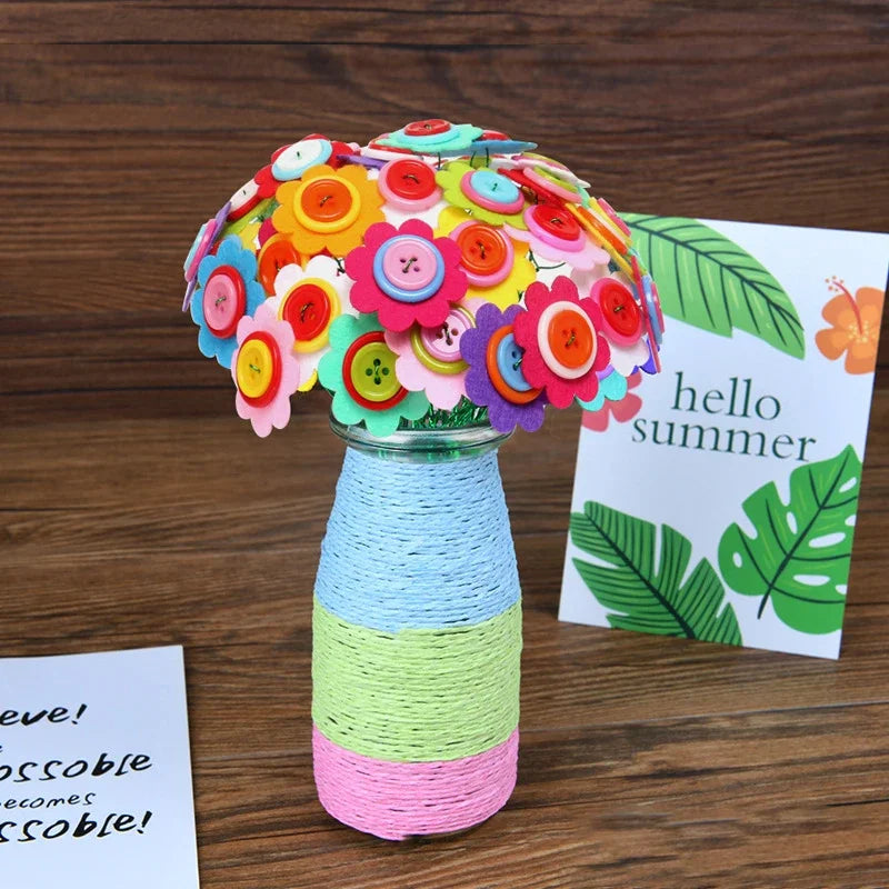 A colorful craft kit featuring felt flowers and buttons arranged in a bouquet displayed in a glass vase.