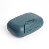 A compact, matte blue leak-proof travel soap box with a hinged lid.